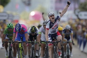 Andre Greipel of Germany clenches his fist as he crosses crosses the